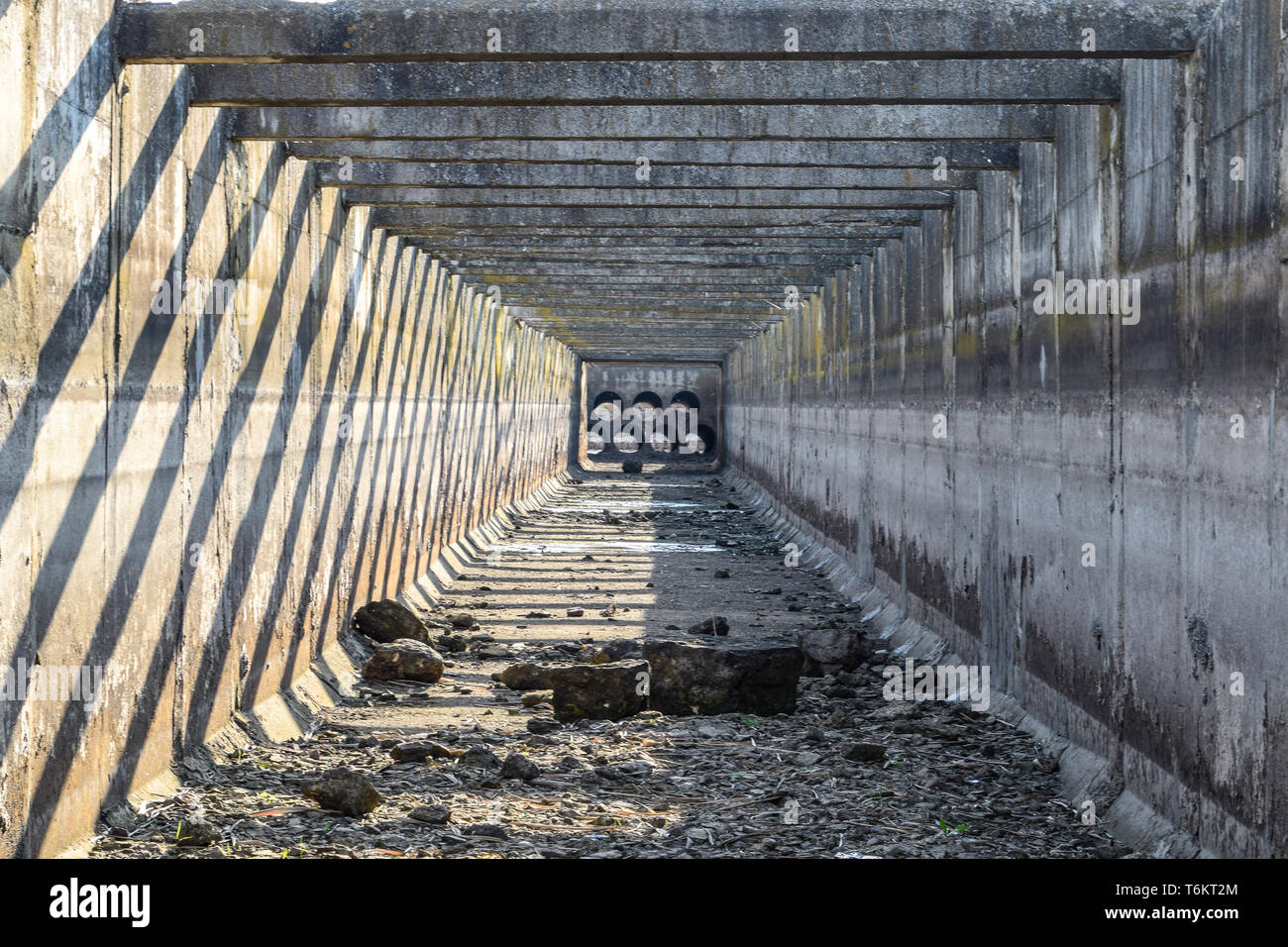 Canal irrigation system rice fields. Concrete tunnel for the irrigation ...