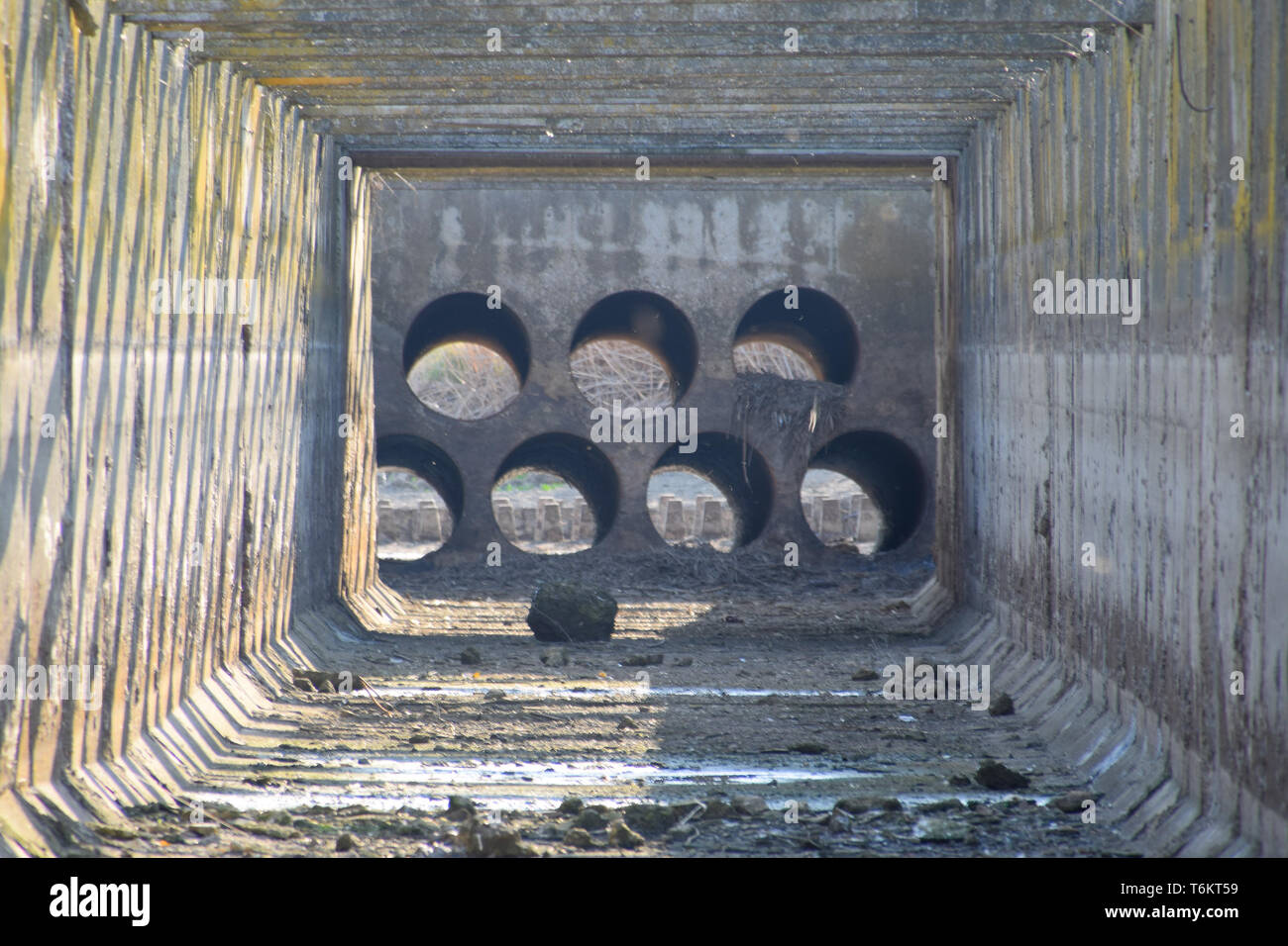 Canal irrigation system rice fields. Concrete tunnel for the irrigation ...