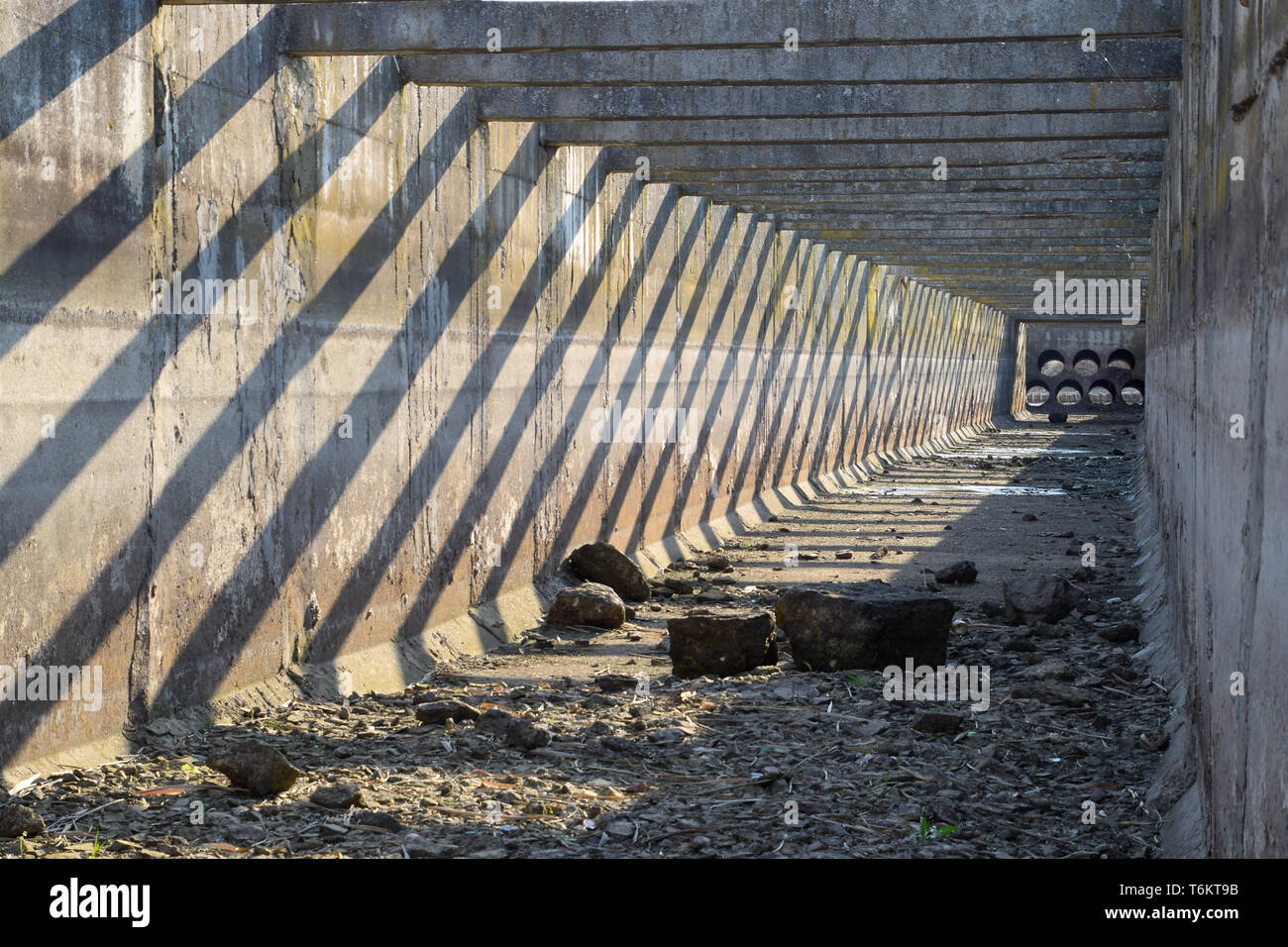 Canal irrigation system rice fields. Concrete tunnel for the irrigation ...