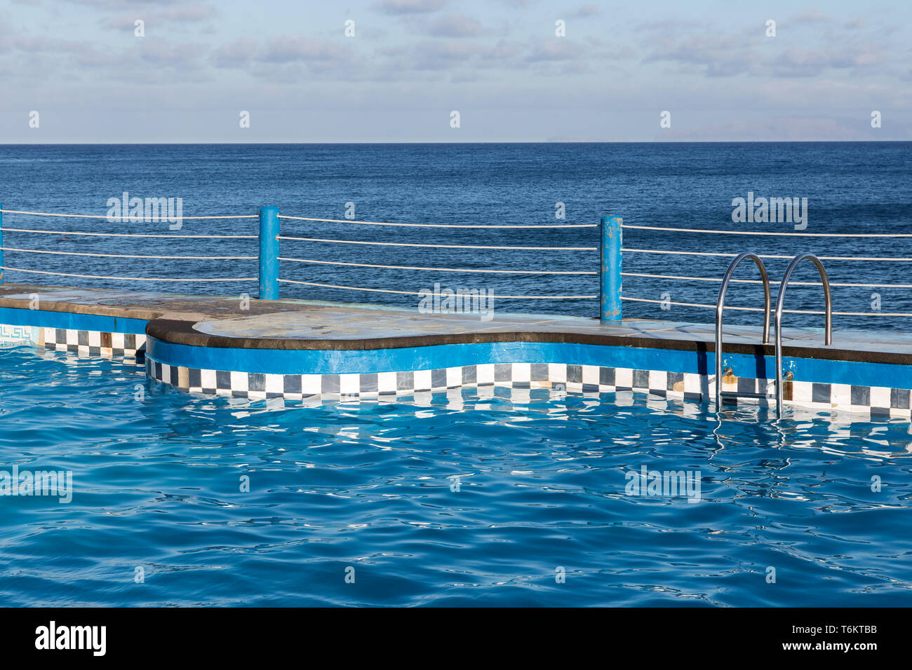 Swimming pool at coast of Madeira Island Stock Photo