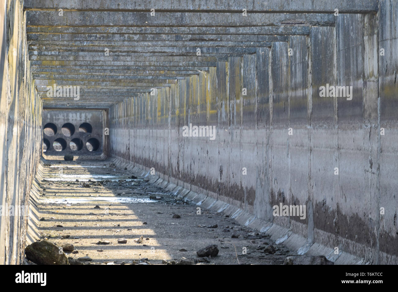 Canal irrigation system rice fields. Concrete tunnel for the irrigation ...