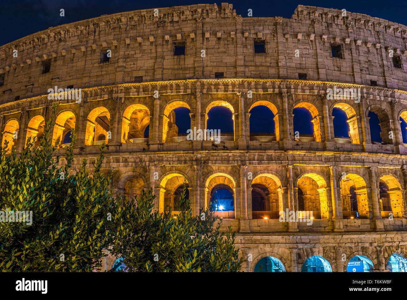 Roman Coliseum and its unmistakable luminous beauty at night in Rome - Italy Stock Photo
