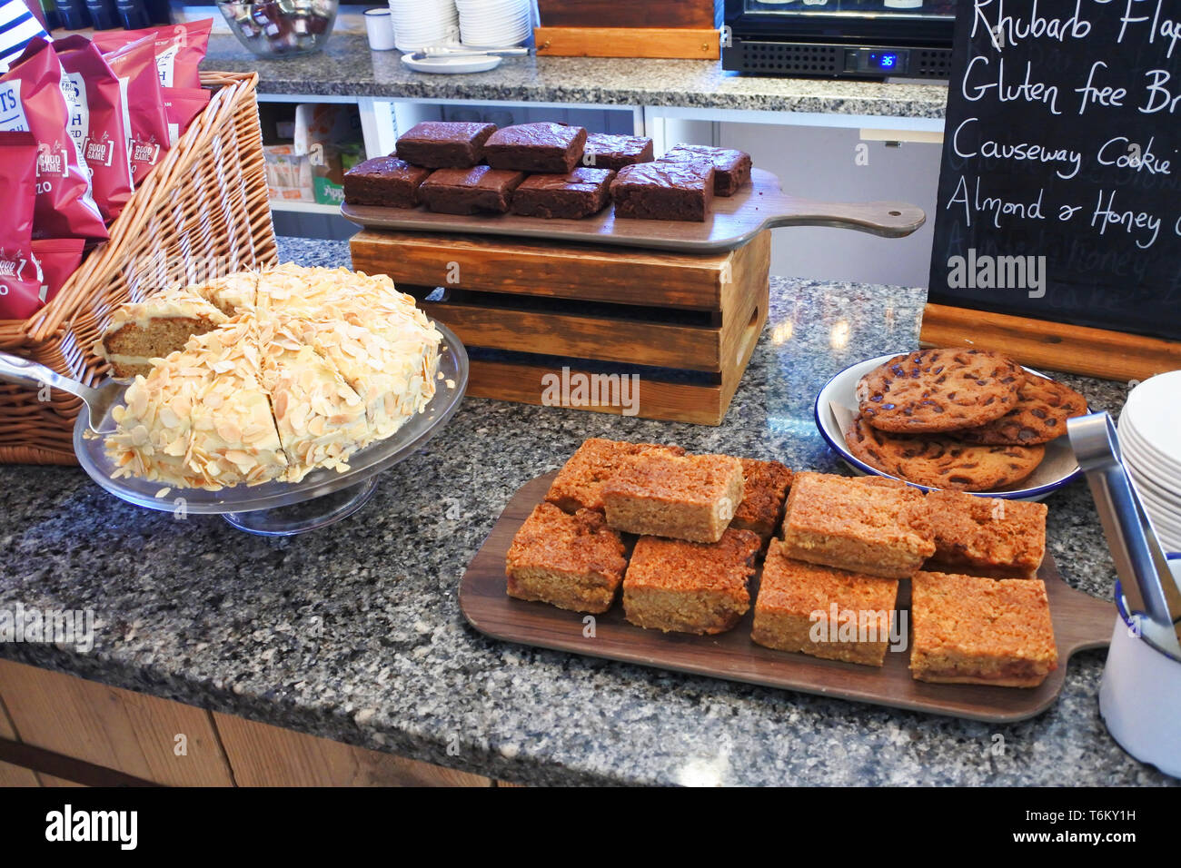 A confectionary display on a counter at a coffee shop, UK - John Gollop Stock Photo