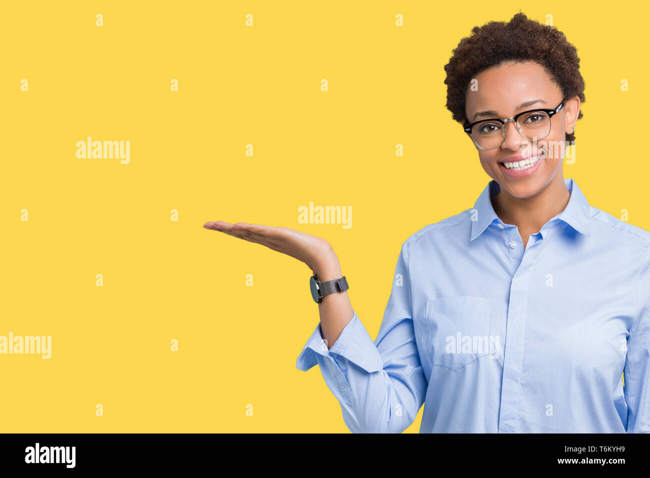 Young beautiful african american business woman over isolated ...