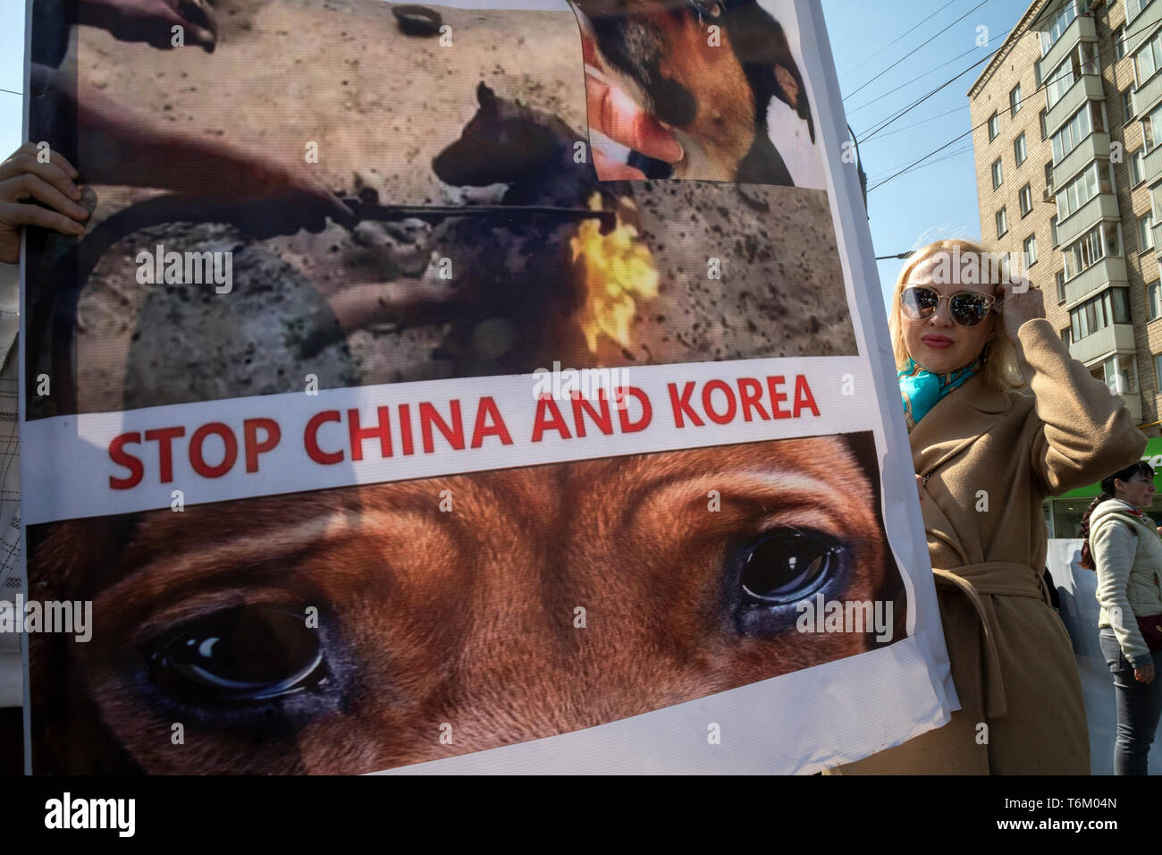 Moscow, Russia. 1st May, 2019 People hold posters with demand to stop dog meat during the Animal March through the central streets of Moscow, Russia Stock Photo