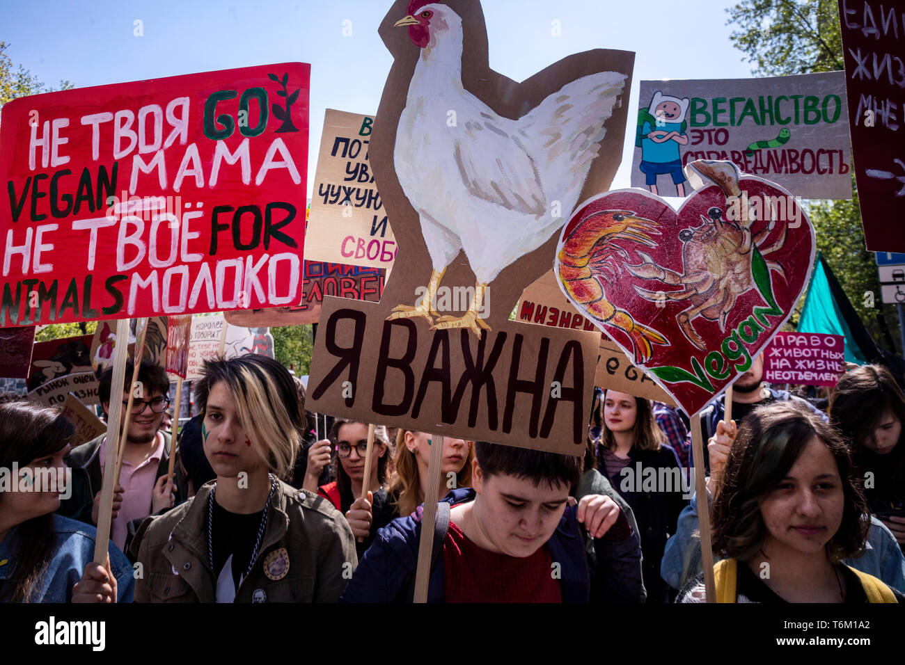 Moscow, Russia. 1st May, 2019 Vegan procession participants hold posters calling for not eating animals in Moscow, Russia Stock Photo