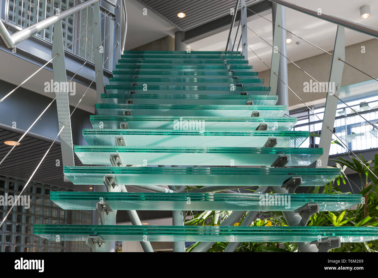 Glass stairway in a modern office building Stock Photo