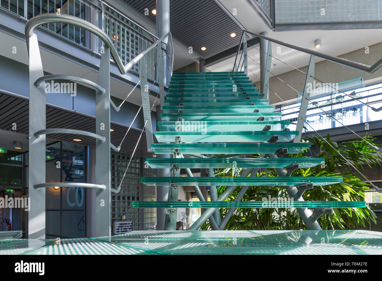 Glass stairway in a modern office building Stock Photo