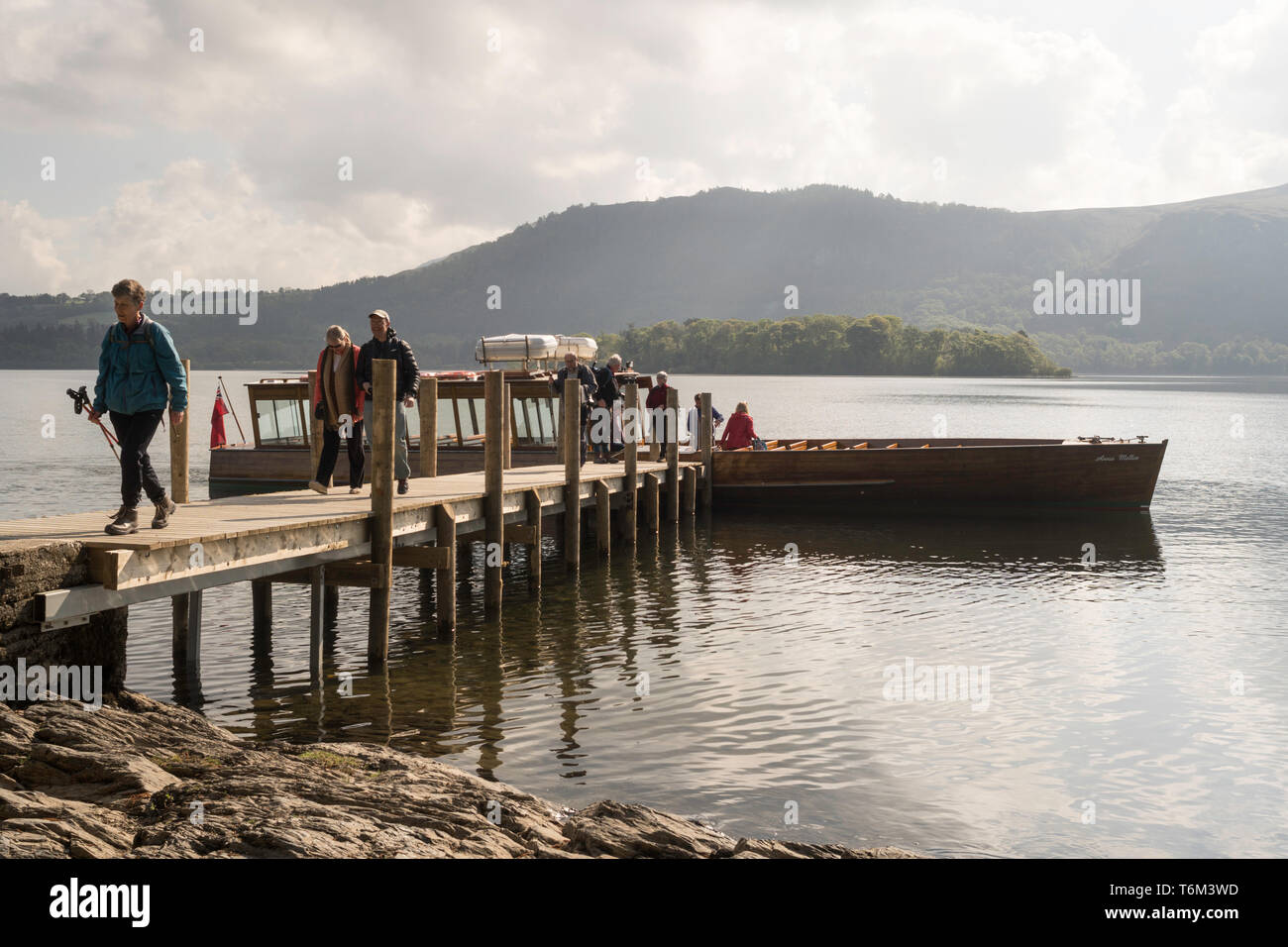 Passengers disembarking from Keswick Launch company boat Annie Mellor at Hawse End jetty, Derwentwater, Cumbria, England, UK Stock Photo
