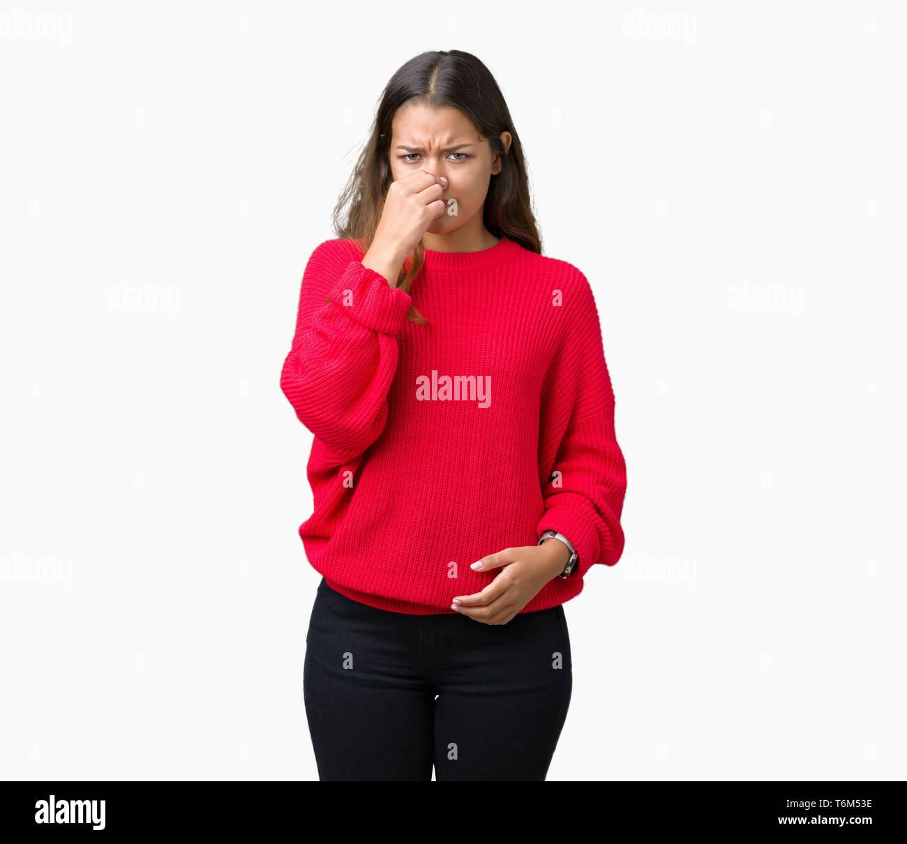 Young beautiful brunette woman wearing red winter sweater over isolated ...