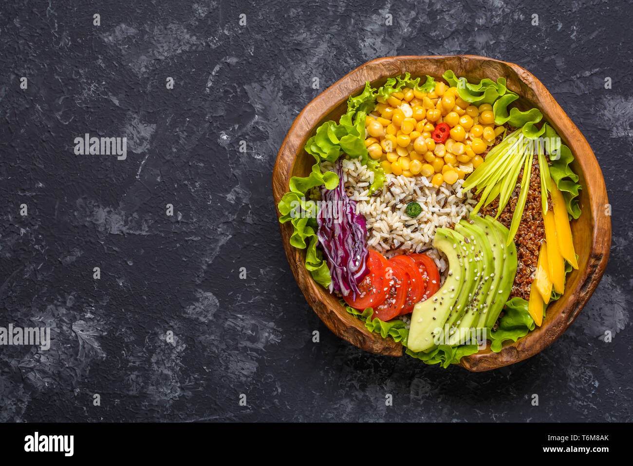Buddha bowl with chickpea, avocado, wild rice, quinoa seeds, bell