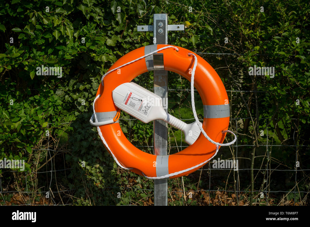 Modern lifebuoy with integral throw line holder by the Thames at Goring-on-Thames, Oxfordshire. Stock Photo