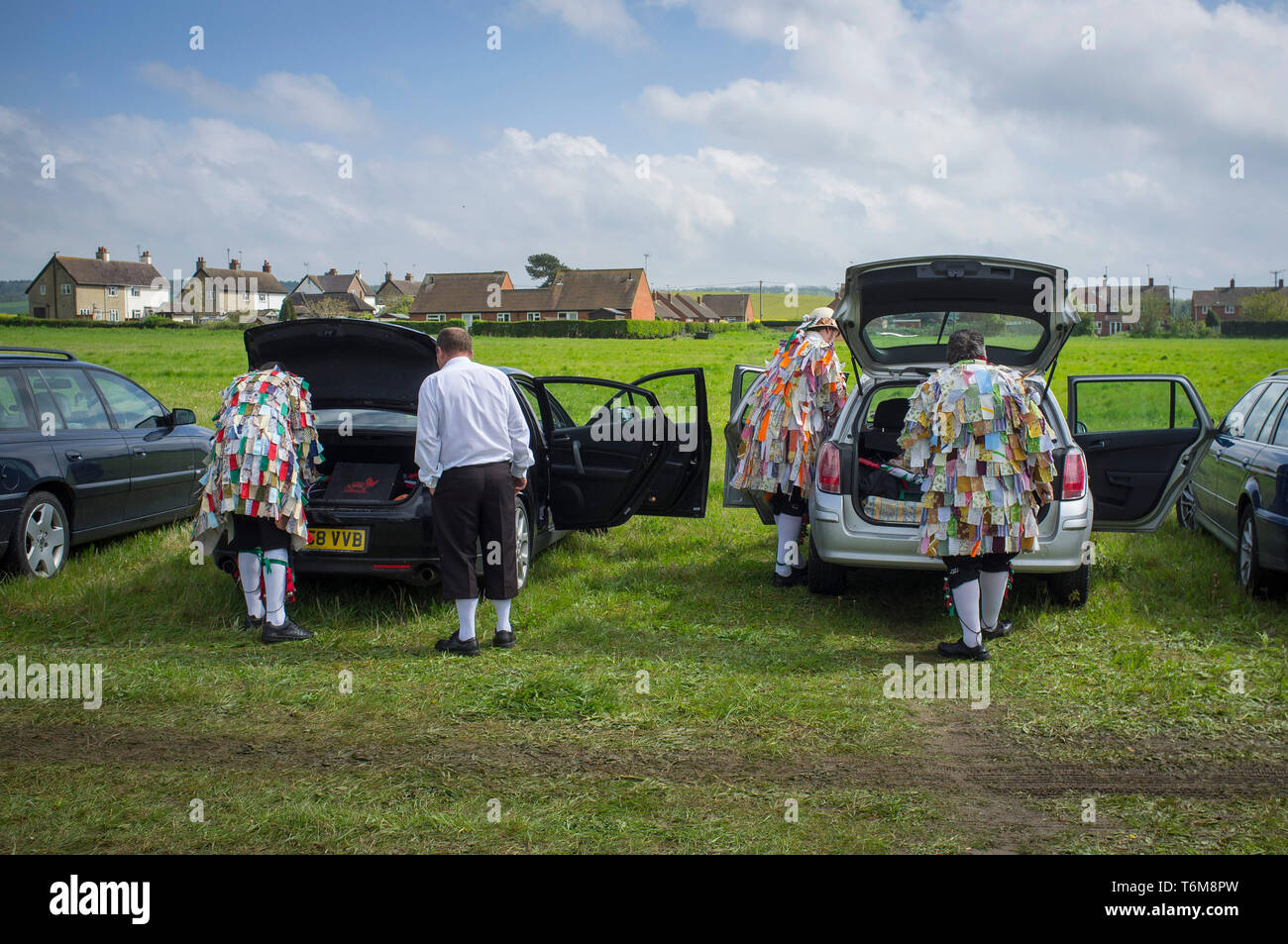 Morris Dancers get ready by their cars before the South Stoke May Fair in Oxfordshire. Stock Photo