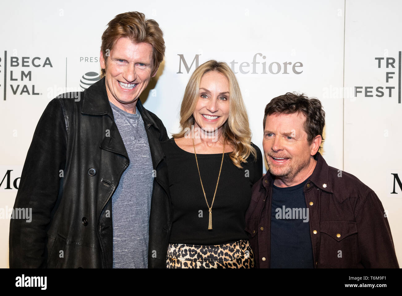 Denis Leary, Tracy Pollan and Michael J. Fox are seen on the red carpet for Tribeca Talks, Storytellers, Michael J. Fox with Denis Leary during the Tribeca Film Festival at The Stella Artois Theatre in New York. Stock Photo