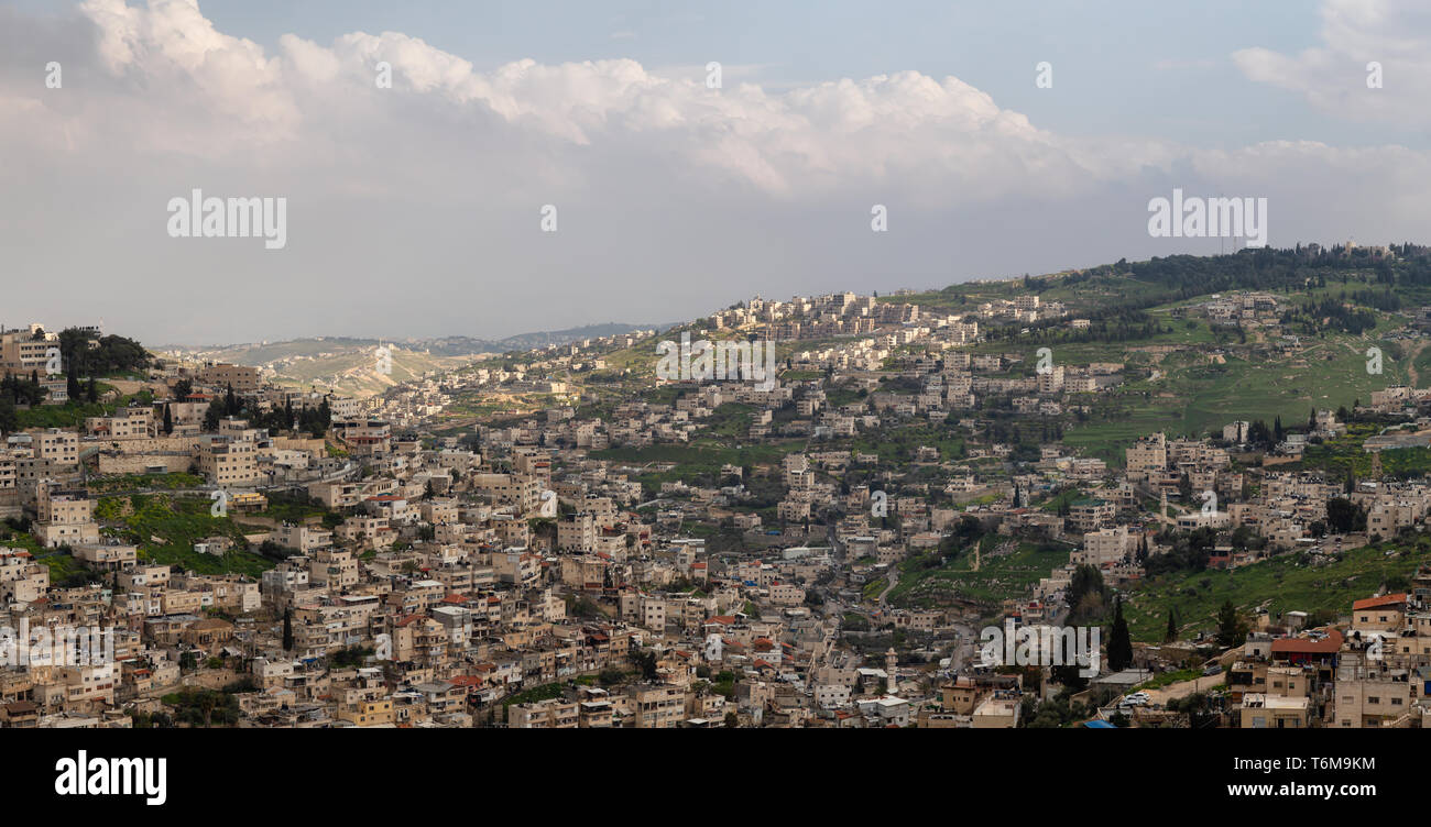Aerial panoramic cityscape view of Jabal Batin alHawa residential neighborhood during a cloudy day. Taken in Jerusalem, Israel. Stock Photo