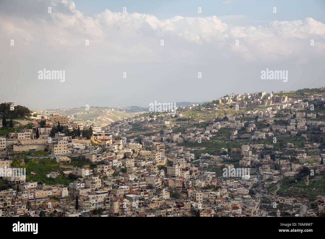 Aerial cityscape view of Jabal Batin alHawa residential neighborhood during a cloudy day. Taken in Jerusalem, Israel. Stock Photo