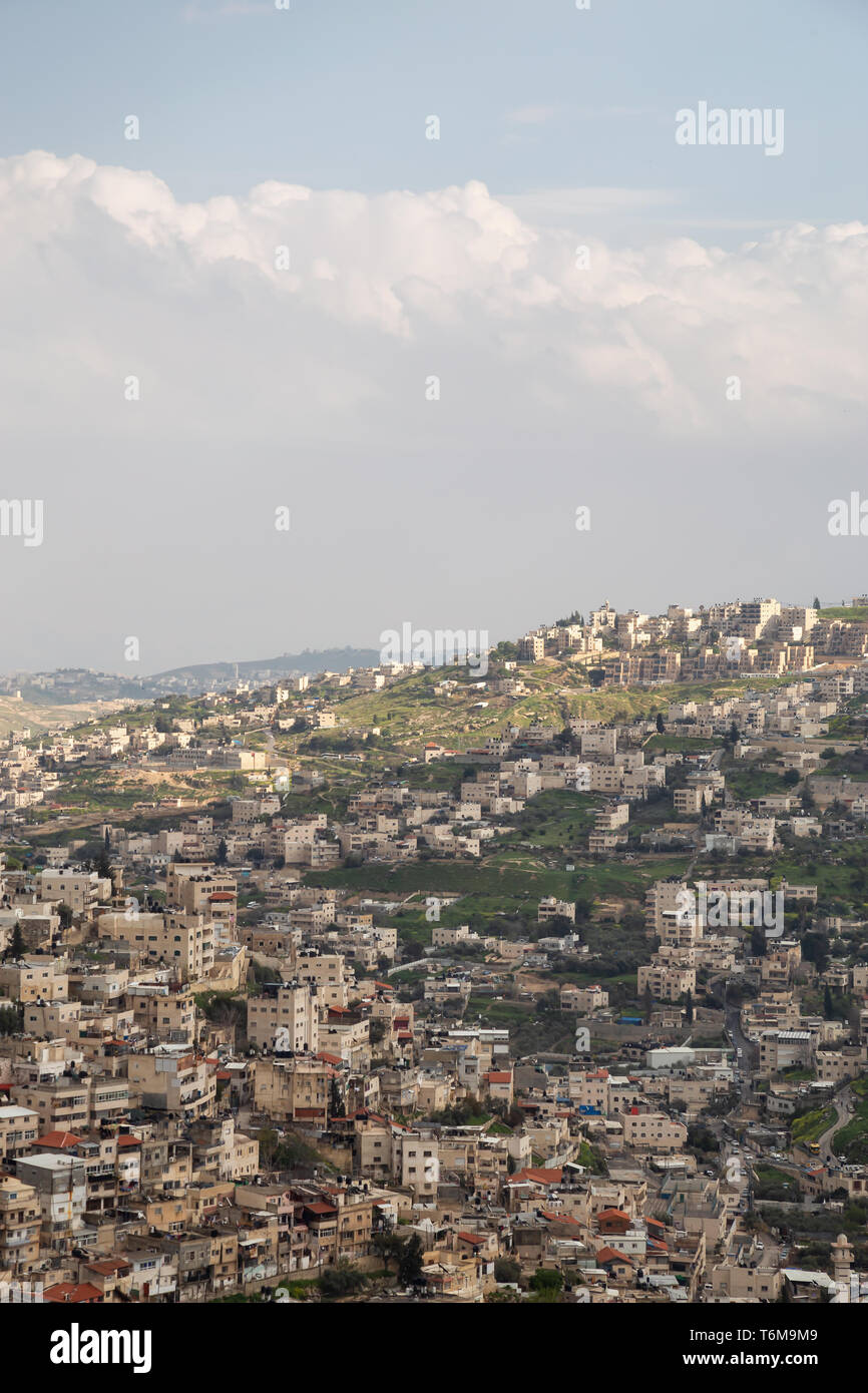 Aerial cityscape view of Jabal Batin alHawa residential neighborhood during a cloudy day. Taken in Jerusalem, Israel. Stock Photo