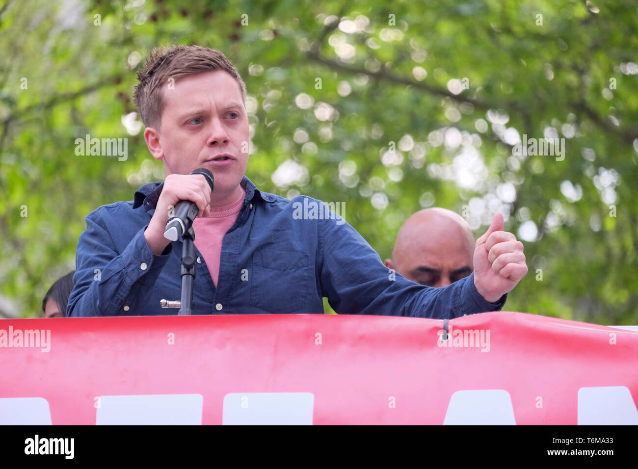 Owen Jones, newspaper columnist and left-wing political activist addresses rally in Parliament Square, Westminster, London, UK Stock Photo