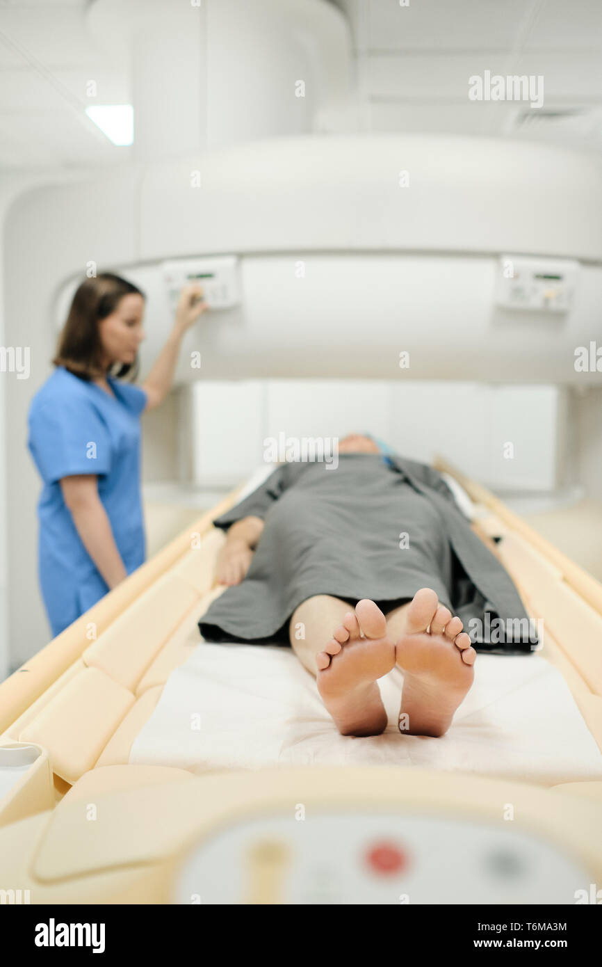 Mature Patient With Health Problems And Doctor In Medical Center Stock Photo
