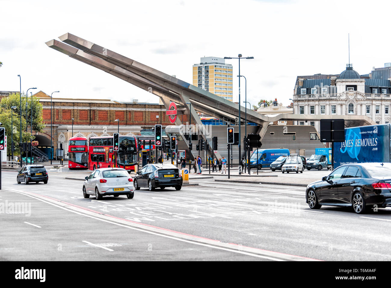 London, UK - September 14, 2018: Vauxhall neighborhood with modern architecture of station and bus stop with traffic and cars on street road Stock Photo
