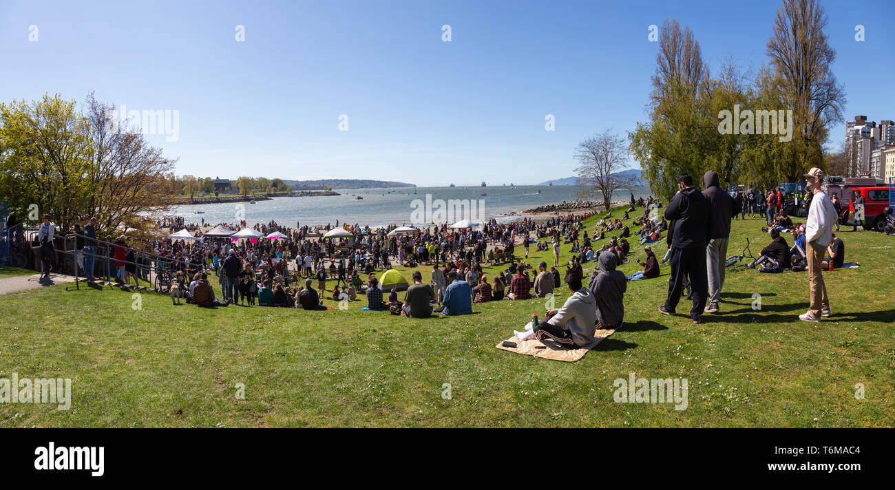 Downtown Vancouver, British Columbia, Canada - April 20, 2019: Crowd of people are gathered to celebrate 420 at Sunset Beach during a sunny day. Stock Photo