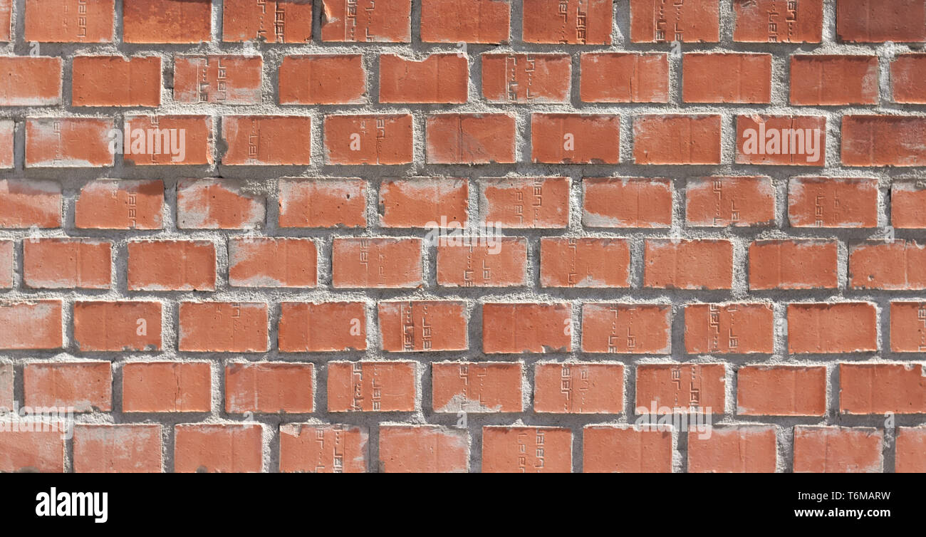 Orange brown brick background with grey grout. Stock Photo