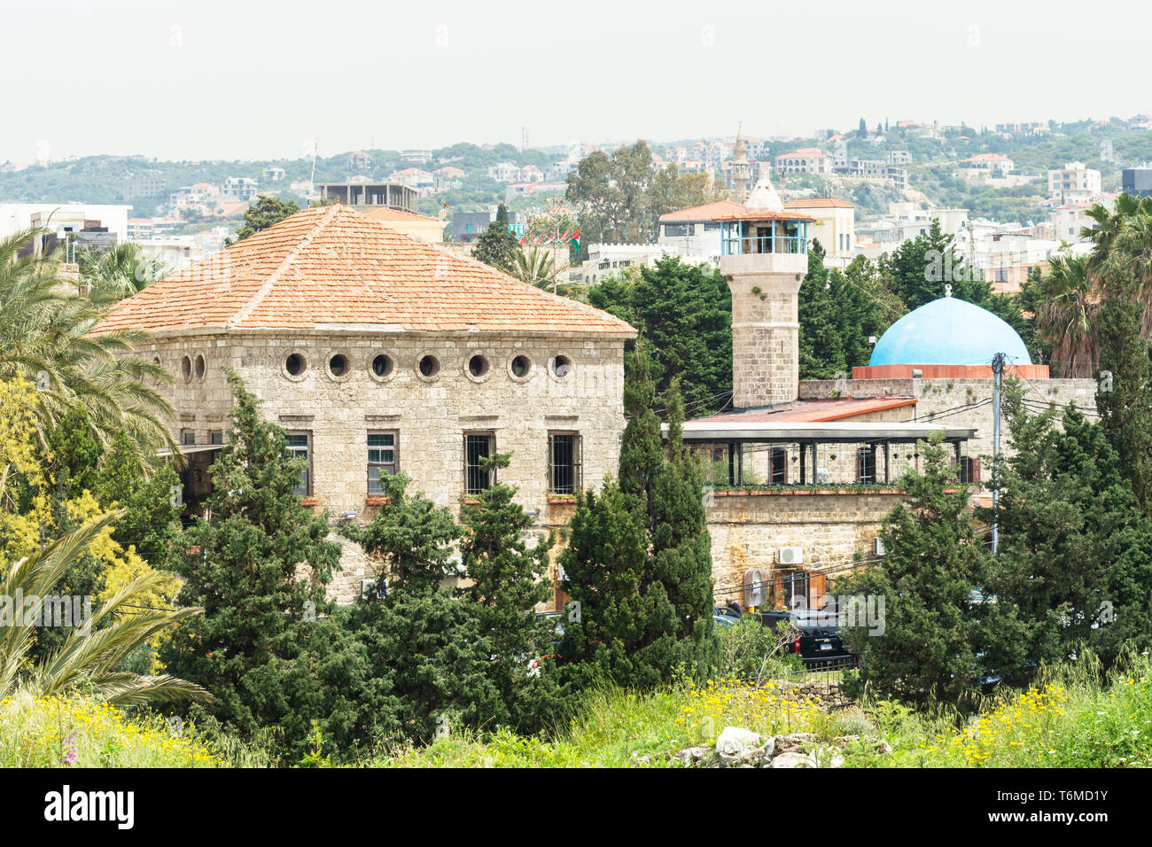 Sultan Abdul Majid mosque and an old house built in traditional Lebanese architecture, Byblos, Lebanon Stock Photo