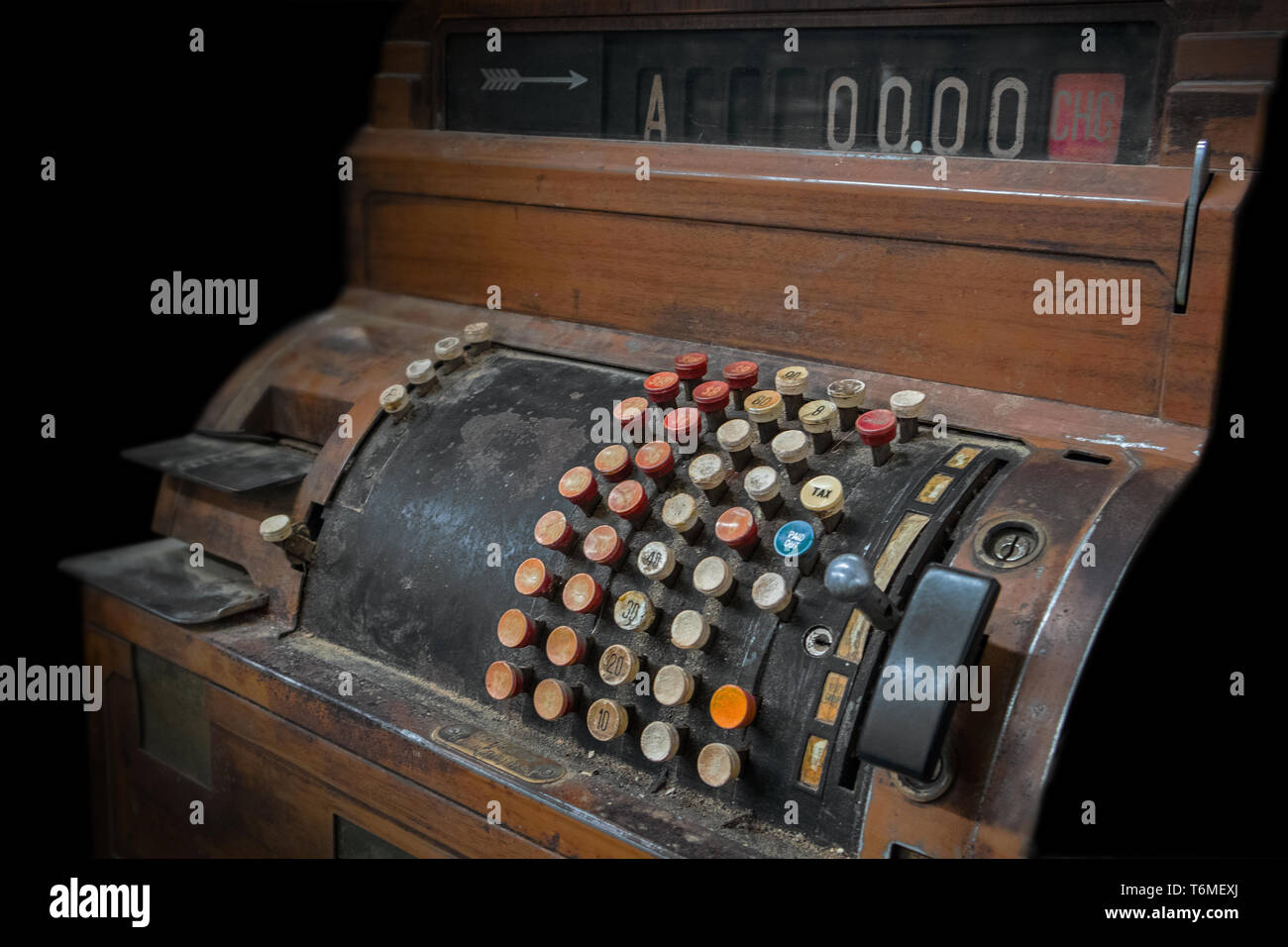 Antique cash register made of wood, Low key. Stock Photo