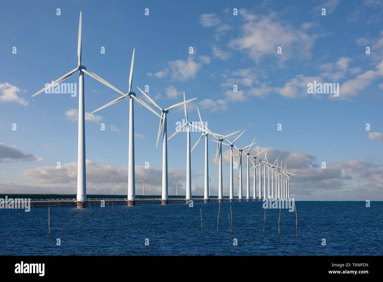 Enormous windmills standing in the sea Stock Photo