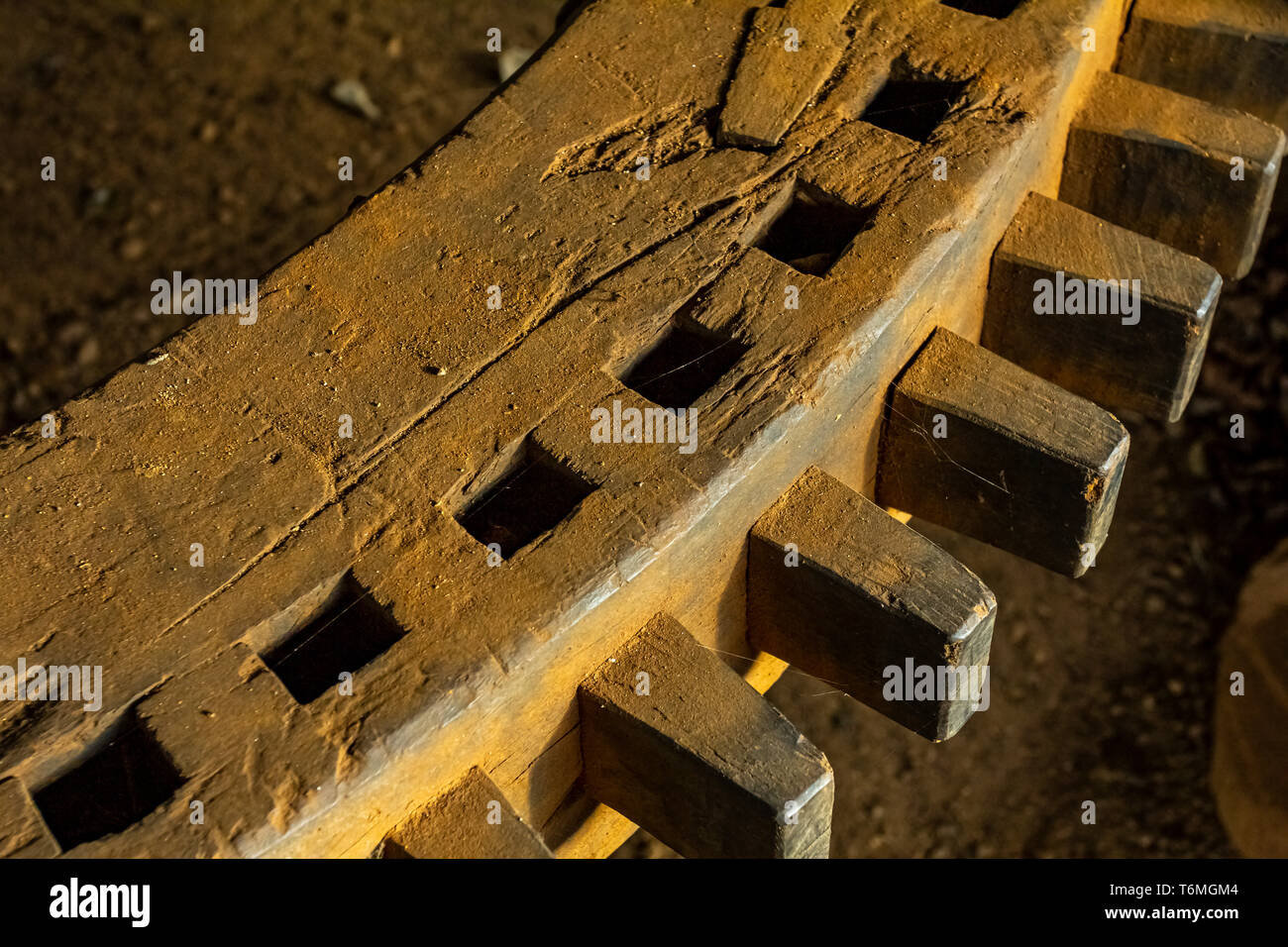 Wooden gear wheels. An ancient wooden rotating gear wheel at the mill ...