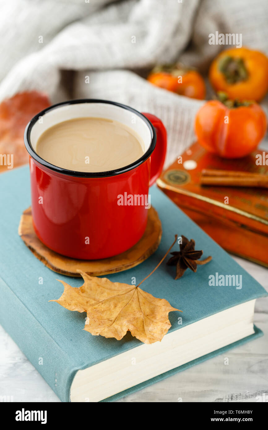 Autumn light still life with coffee and book Stock Photo - Alamy