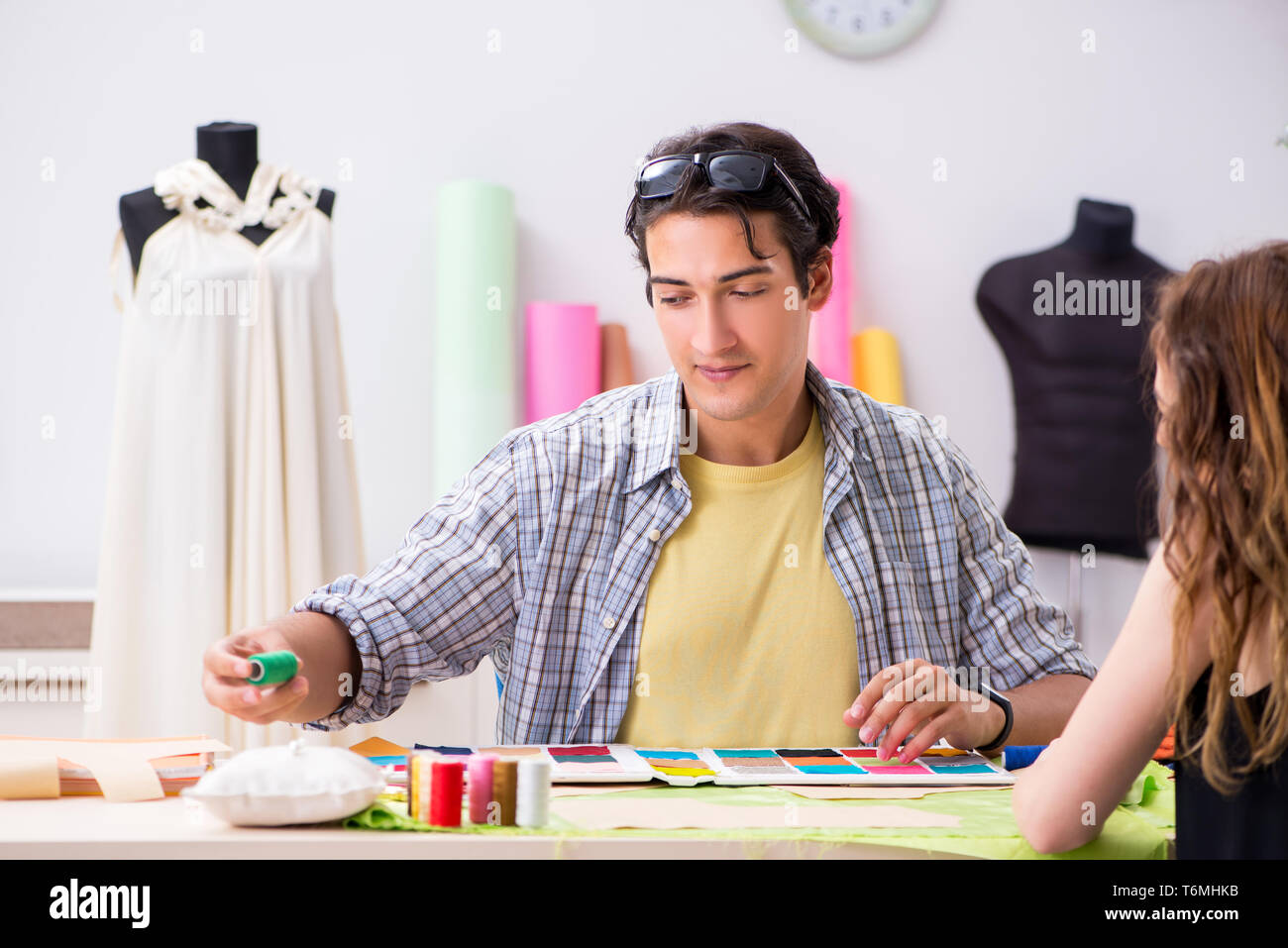 Young tailor working in his workshop Stock Photo - Alamy
