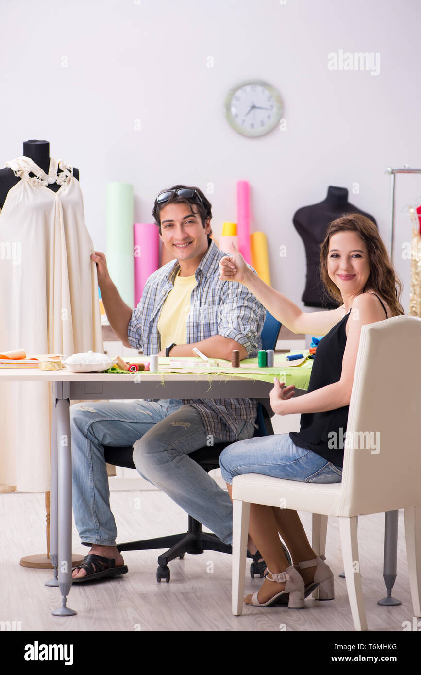 Young tailor working in his workshop Stock Photo - Alamy
