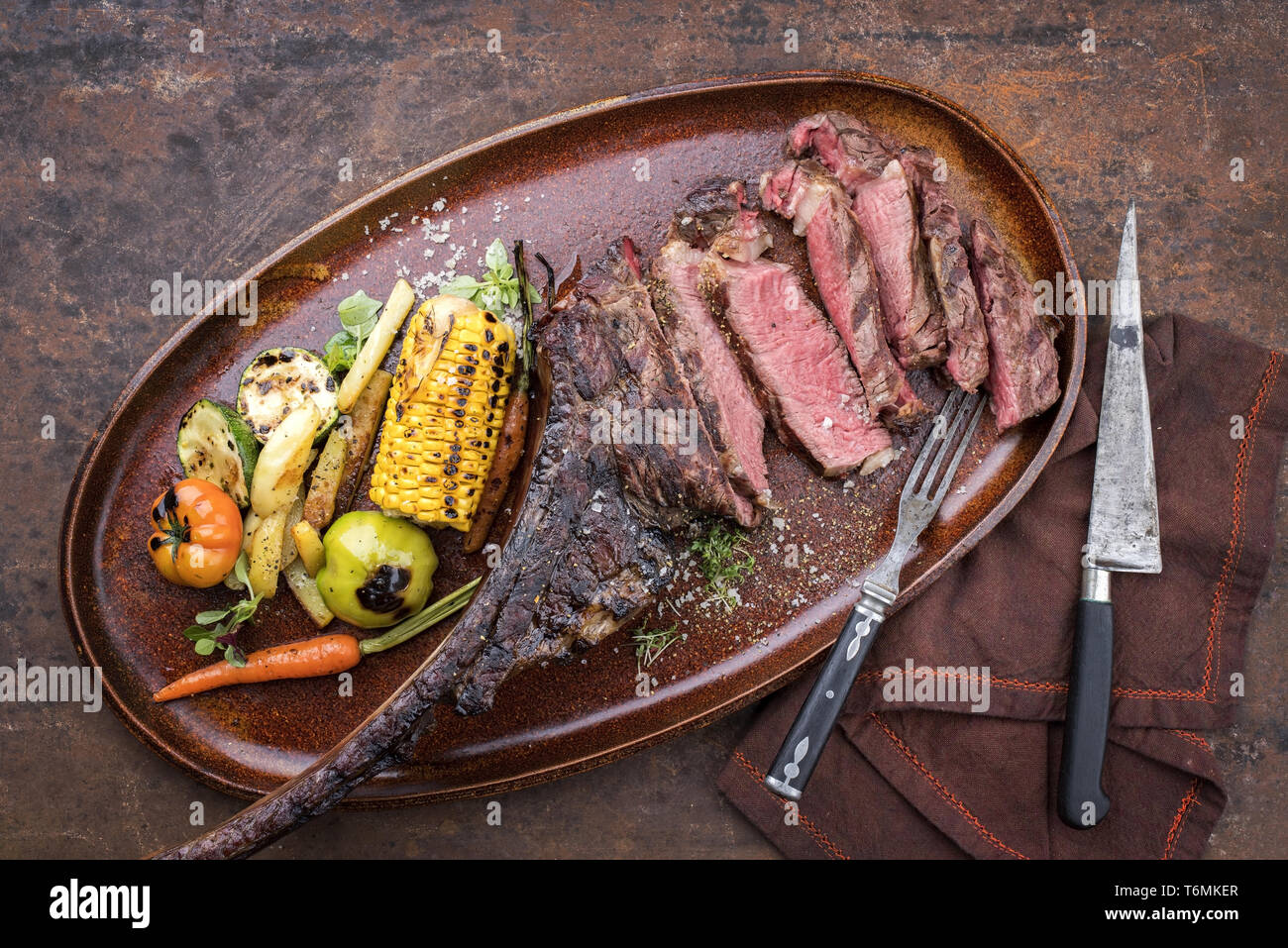 Traditional barbecue dry aged sliced wagyu tomahawk steak with grilled