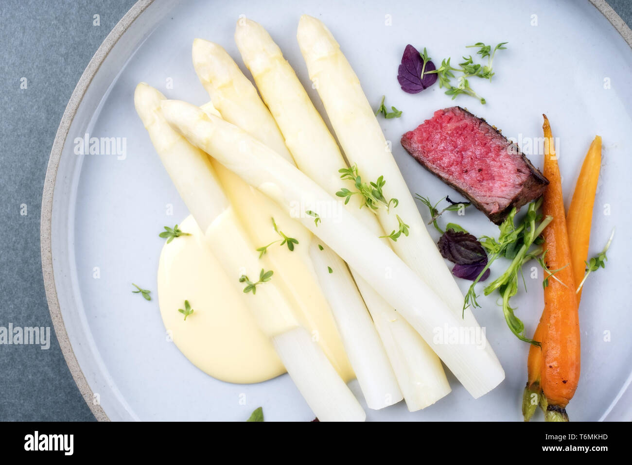 Modern Barbecue Dry Aged Sliced Fillet Steak With White Asparagus