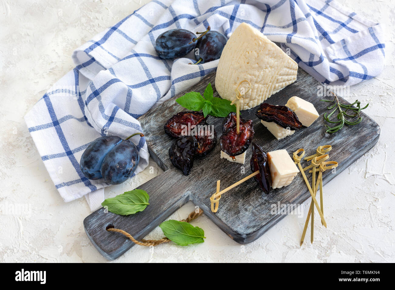Dried plum with spices and homemade cheese Stock Photo Alamy