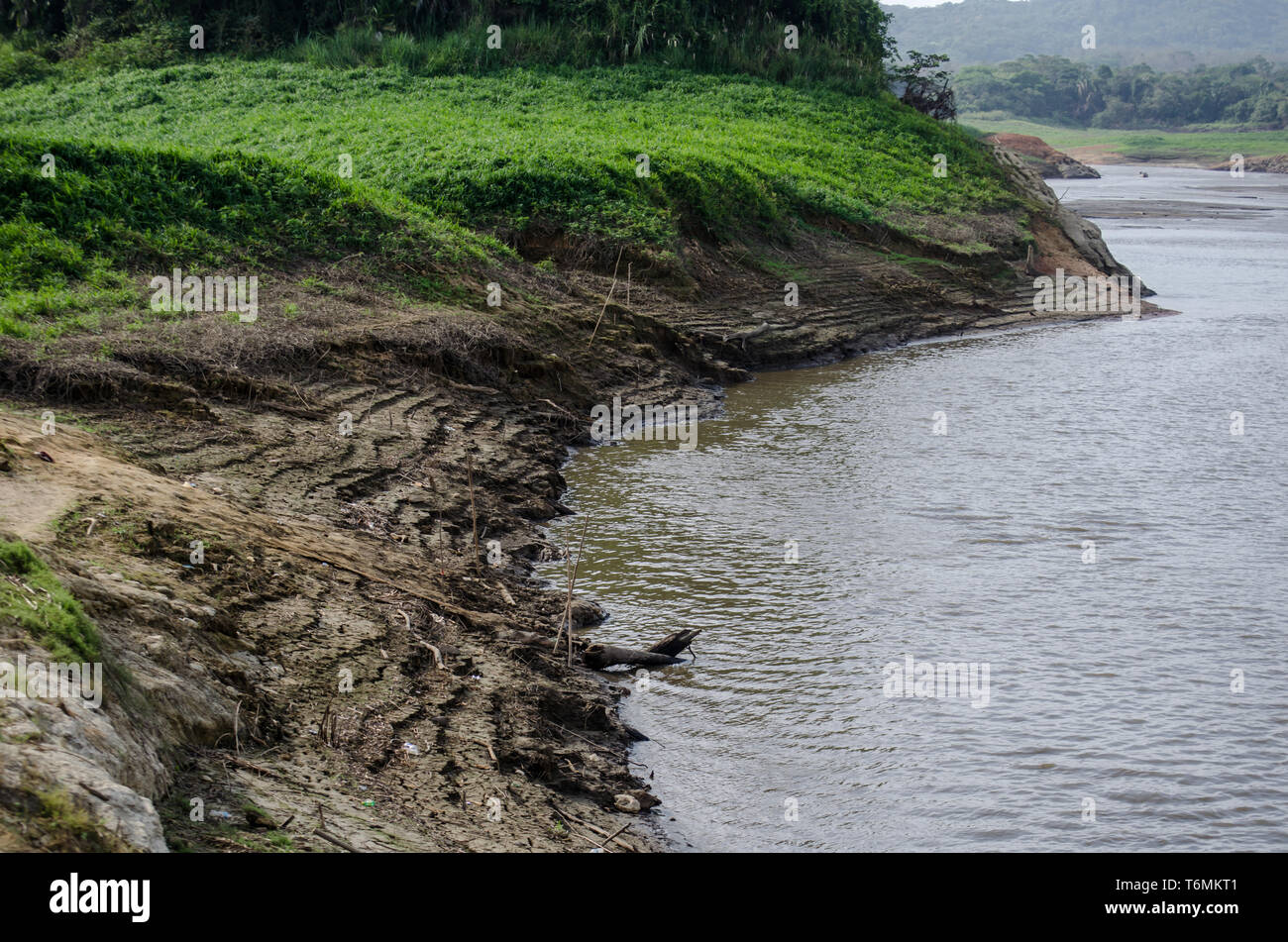 Drought effects are seen in the shores of Lake Alajuela. The water levels is several meters below the expected. Stock Photo