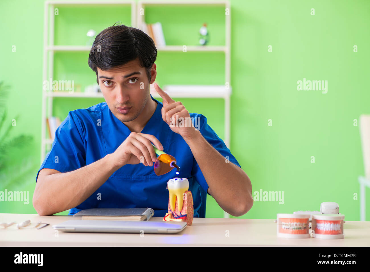 Dentist doctor working in the clinic Stock Photo Alamy