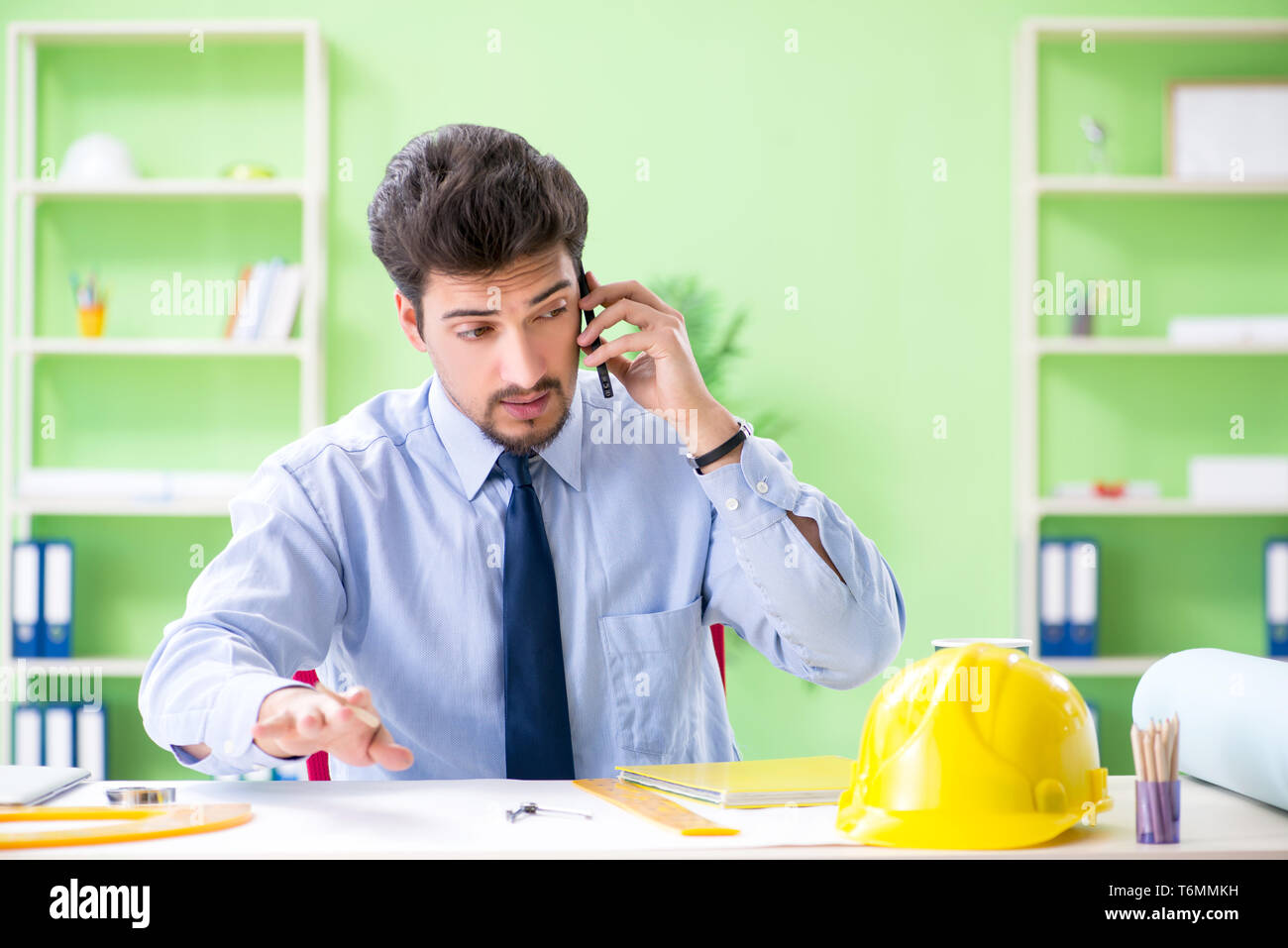 Male architect explaining building hi-res stock photography and images ...