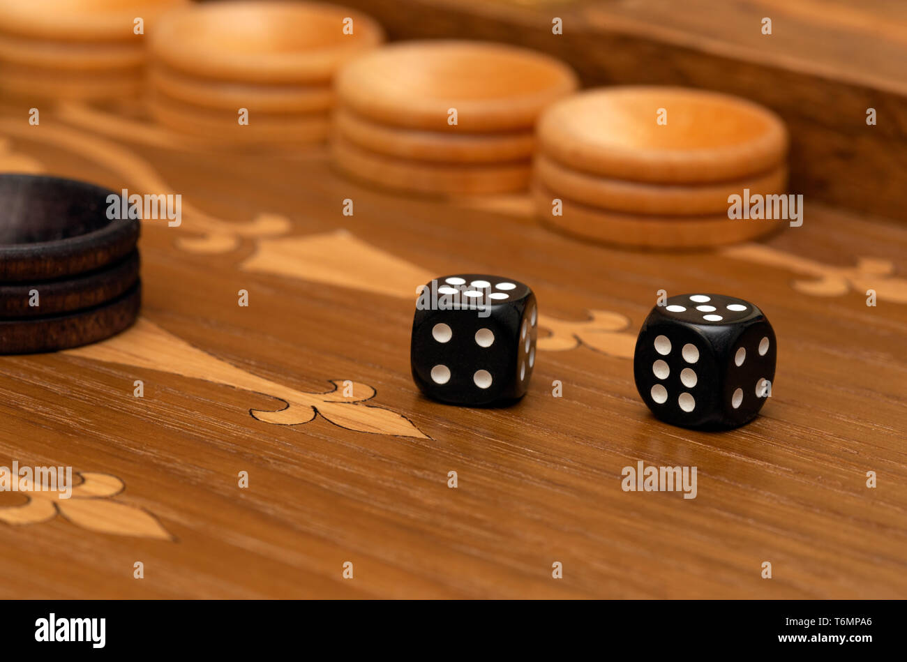 Dice on a backgammon board Stock Photo