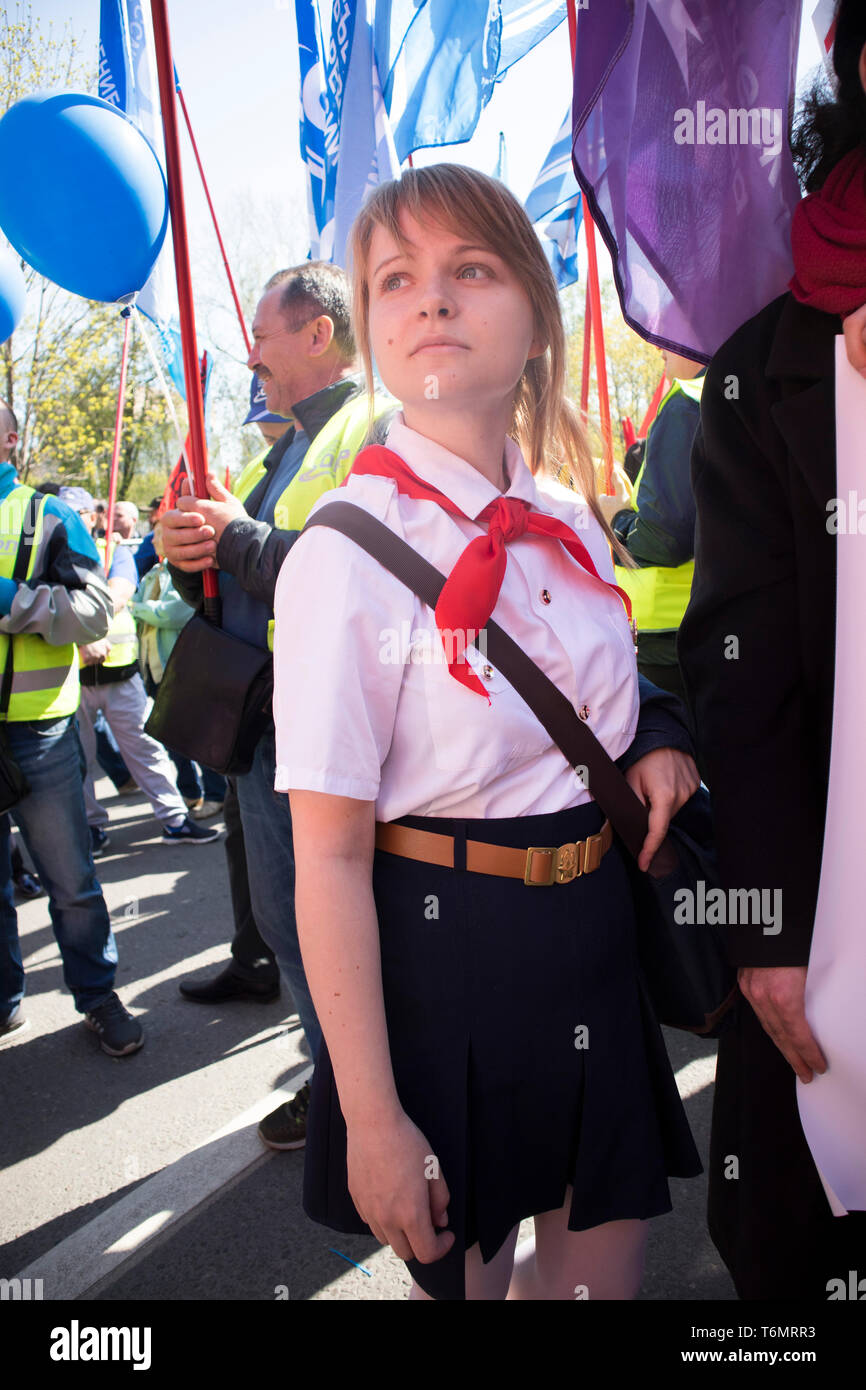 Moscow, RUSSIA - MAY 1, 2019: Moscow's Labor Day Parade. The girl in the pioneer form in the communist column Stock Photo