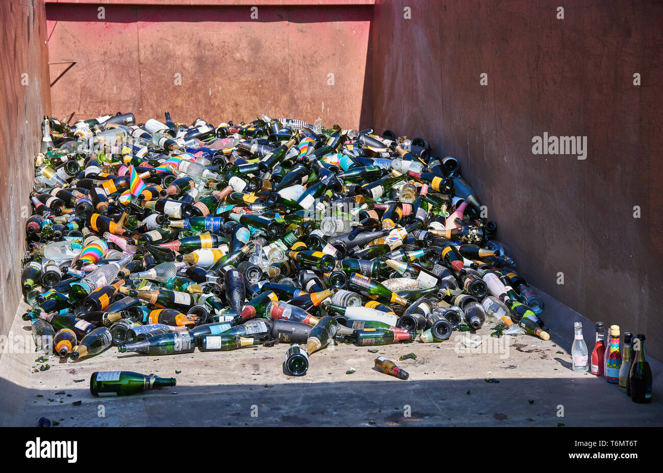 Helsinki, Finland - May 1, 2019: Pile of recycled sparkling wine bottles on a large open interchangeable platform after first of May celebrations in K Stock Photo