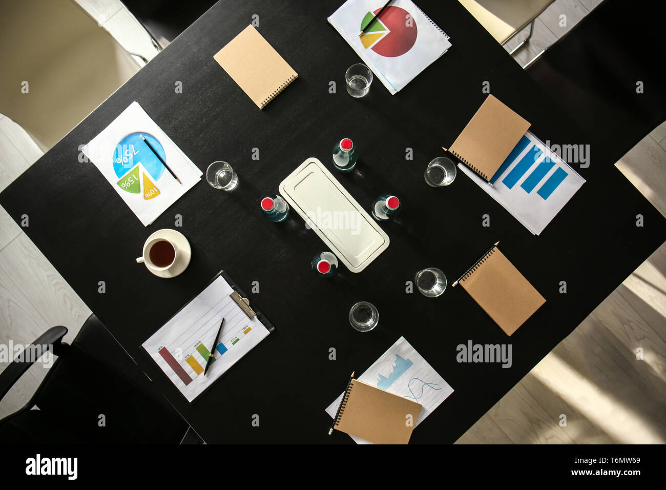 Table with documents and bottles of water prepared for business meeting ...