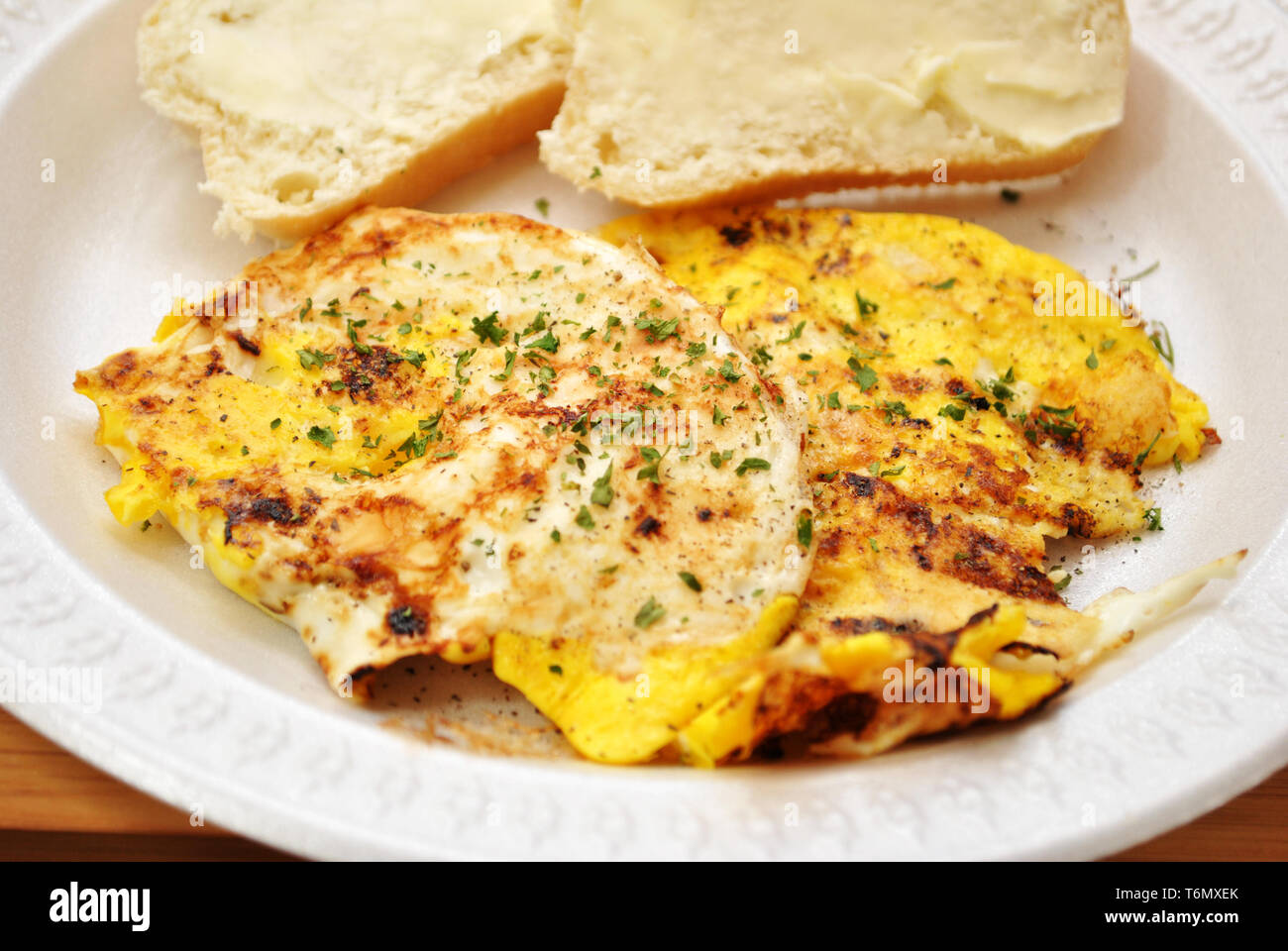 Fried Eggs with Buttered Bread Stock Photo