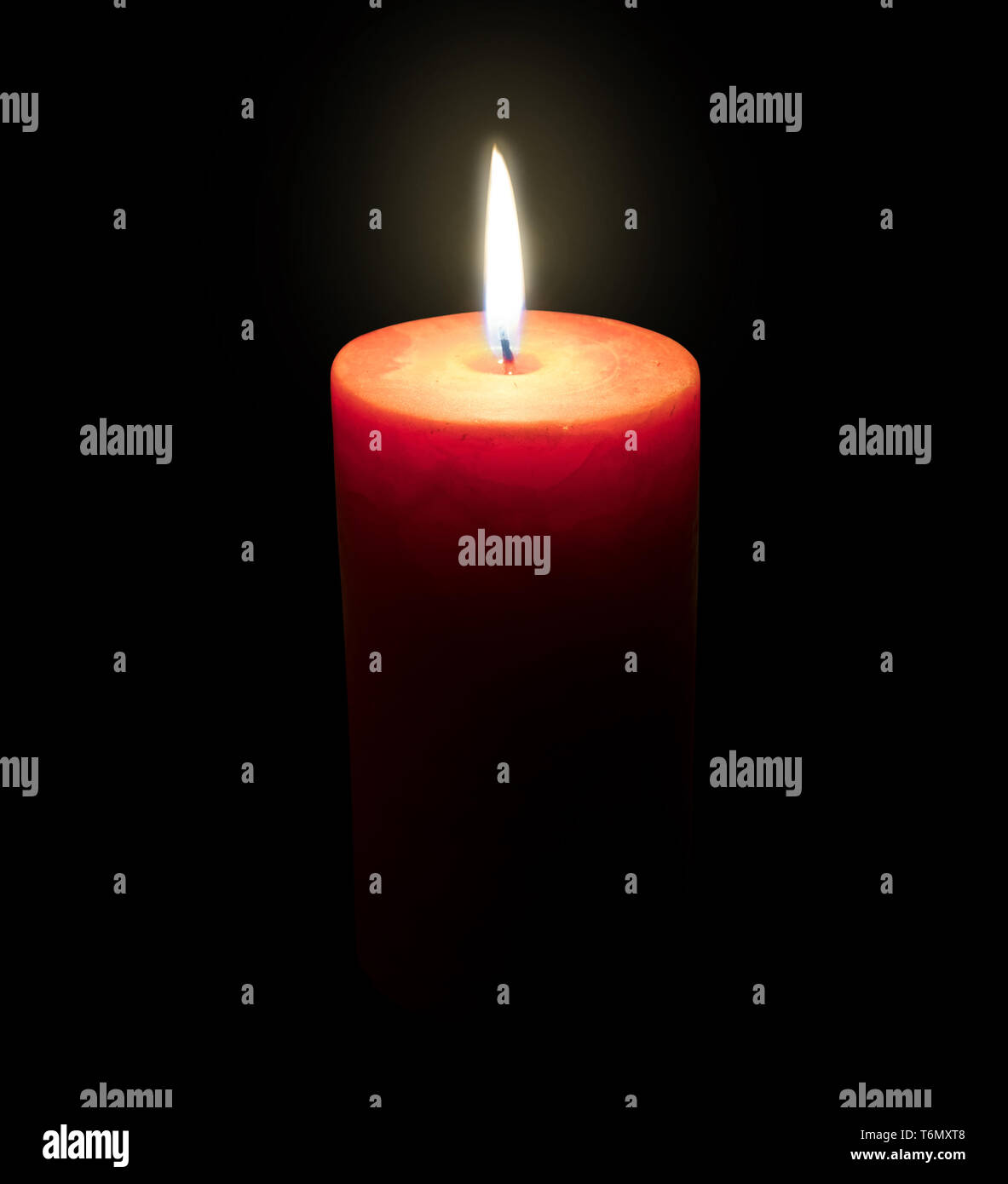 Burning candle isolated on black Stock Photo Alamy