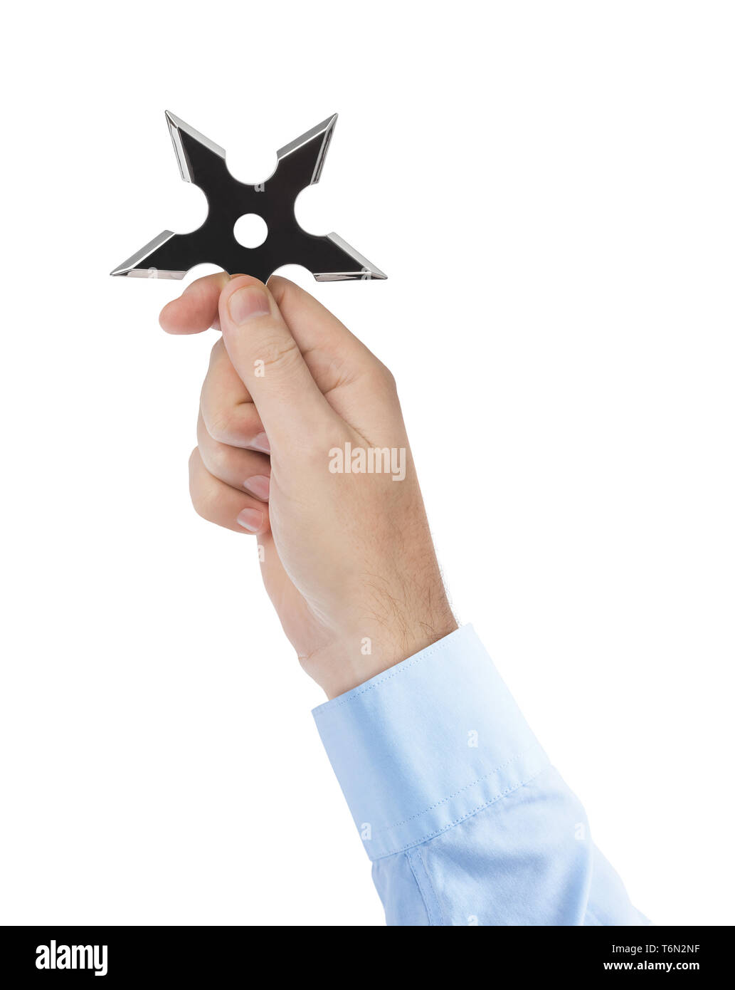 Hand is throwing ninja shuriken Stock Photo