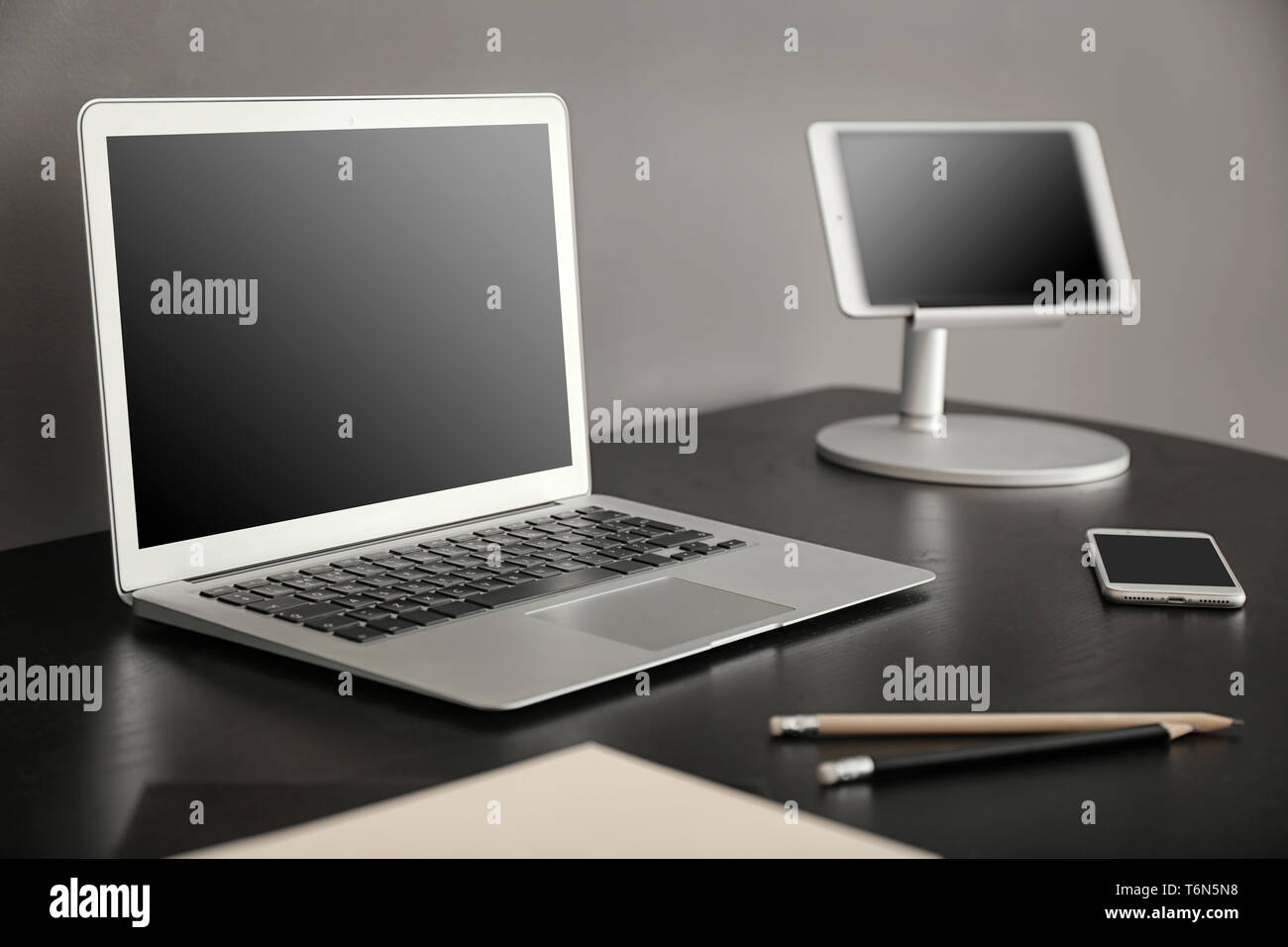 Comfortable workplace with laptop on table Stock Photo