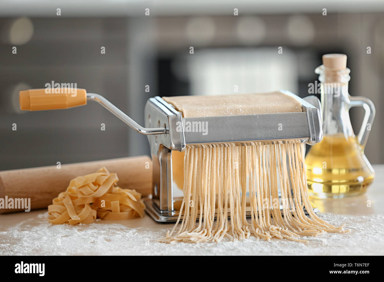 Table For Pasta Machine Pasta maker and products on kitchen table Stock Photo - Alamy