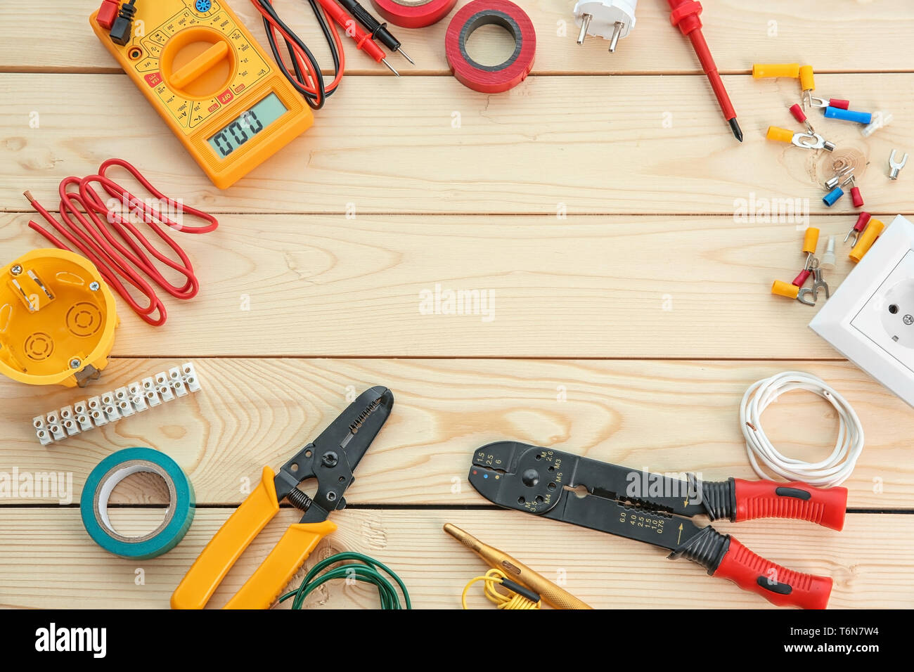 Flat lay composition with electrical tools on wooden background Stock Photo