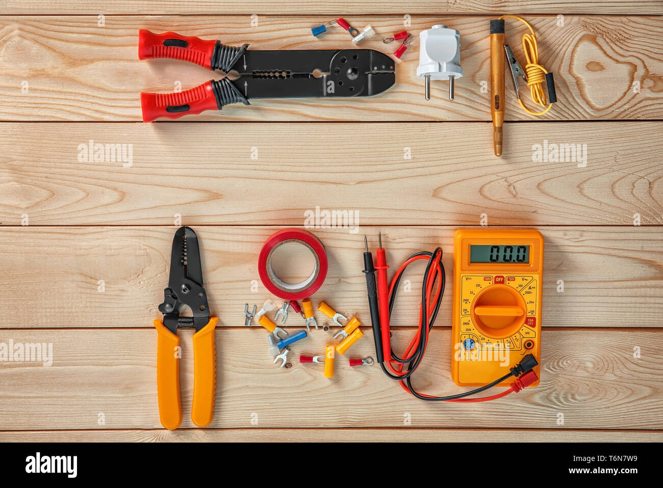 Flat lay composition with electrical tools on wooden background Stock Photo